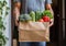 Man holding delivery paper bag with food from online grocery shopping.Macro.AI Generative