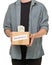 Man holding donation cardboard box with dollar banknotes