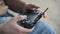 Man holding drone remote controller closeup