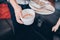 Man holding empty Chinese food containers at home after lunch