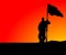 Man holding Flag in Sunset