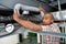 Man holding flexible hose in roofspace