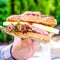 Man Holding A Fresh Ploughmans Salad Bread Roll