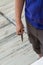 A man holding a garden pruner in his hands