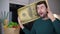 Man holding gigantic 100 dollars bill