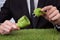 Man holding grass covered cable