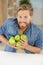 Man holding green apple very happy