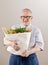 Man holding grocery bag of vegetables and fruits