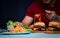 Man holding hamburger on the wooden plate after delivery man delivers foods at home. Concept of binge eating disorder BED and