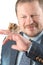 Man holding hamster on arm