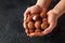 Man holding in hands Tropical Lychee fruits, soapberry