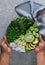 Man holding healthy raw vegetarian green salad