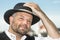 Man holding his Bavarian black hat