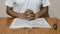 A man holding his hands on open holy book. Prayer concept