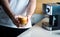 Man holding homemade cappuccino at home