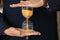 Man holding hourglass, closeup. Time management concept