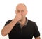 Man holding nose for smell