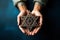 A man holding an old and rusty star of David in their hands on ruins background.