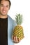 Man Holding Pineapple