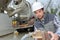 Man holding pipe next to cement lorry