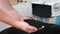 Man holding plastic black gray granulated crumb pouring in the bag