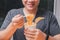 A man holding a plastic fork with cooked instant noodles. Instant noodle is convenient and delicious food