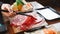 Man holding rare slice Wagyu A5 beef by chopsticks for boiling in Shabu hot pot