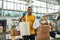 Man holding reusable cotton bag and plastic bag