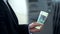 Man holding Russian rubles banknotes withdrawn from ATM, good service, tourism