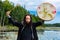 Man holding sacred frame drum with fur stick