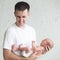 Man holding a screaming newborn