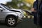 Man holding smartphone and take photo of car accident call for help  damage to car after accident