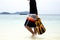 Man holding snorkeling gear come out from the sea in tropical is