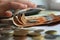 Man holding a stack of American dollar bills. Detail of a macro shot. Money market, finance, currency, bank economy. buying now