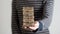 Man holding stack of wooden bricks