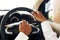 Man is holding the steering wheel of car to control while driving and use hand press Horn of car with take a photo from back view