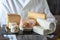 Man holding tray with various french cheeses