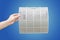Man holding very dirty air conditioner filter with clipping path