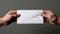 Man holding white envelope with two hands. Generative AI
