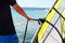 Man holding windsurf sail for rope close-up