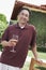 Man Holding Wineglass In Garden