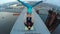 Man holding woman on top of bridge, acrobatic yoga at great height, adrenaline