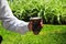 Man holding yerba mate in nature. Travel and adventure concept. Latin American drink yerba mate