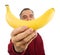 Man holds banana in front of his face