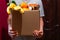 A man holds a box of food, donations for those in need during self-isolation