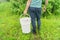 Man holds a compost bucket. Zero waste