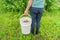 Man holds a compost bucket. Zero waste