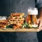 Man holds cutting board snack beer quesadilla lager beer