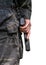 A man holds a gun. Close-up on a white background. Back view