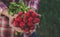 A man holds a harvest radish from the garden in his hands. Selective focus.